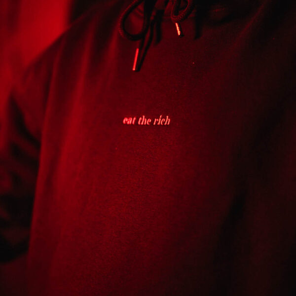 Eat the rich Hoodie by <a href="https://schwupp.cool/artist/k/" style="color:#e288a0;text-decoration: underline;">K</a>
